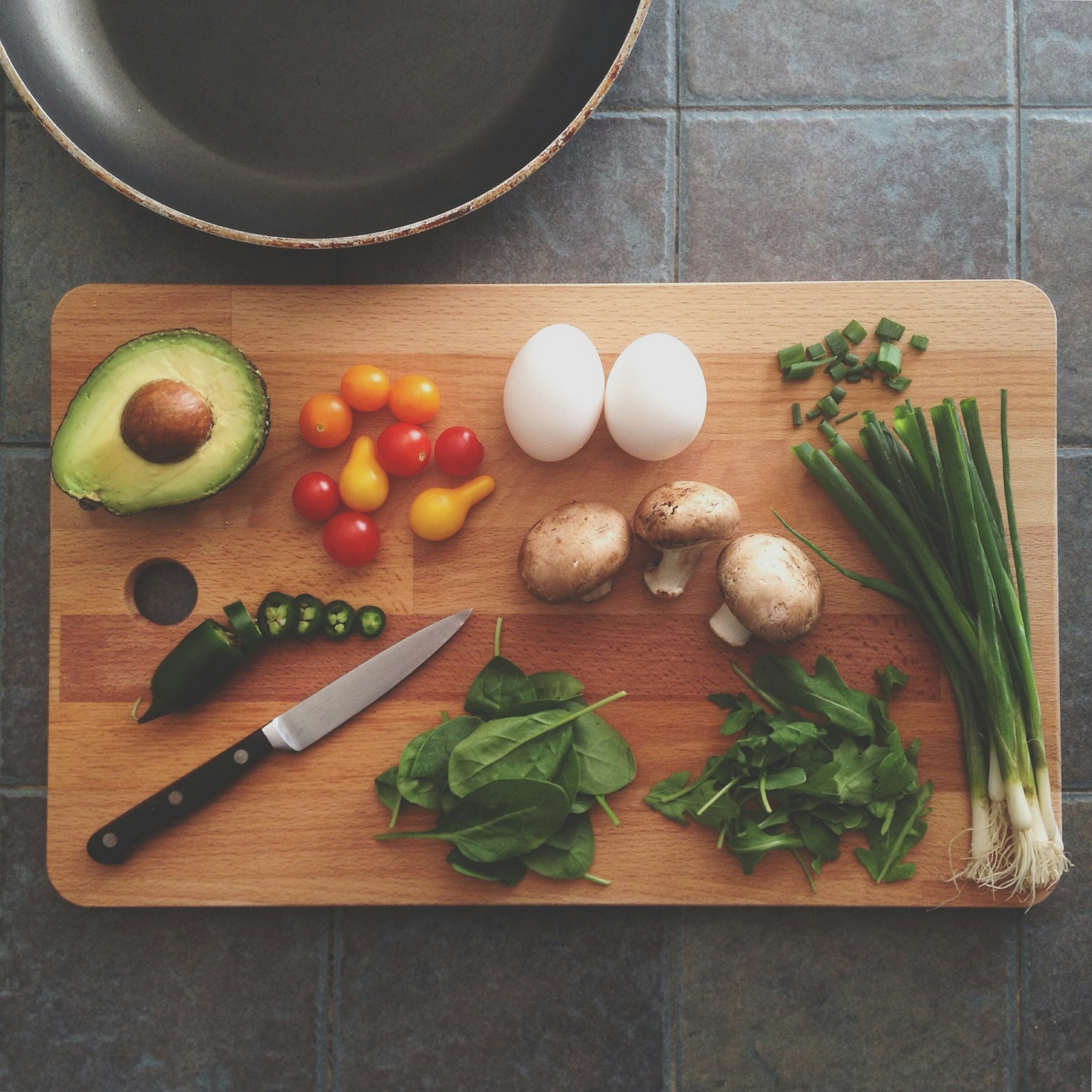 Fresh vegetables and eggs on a cutting board